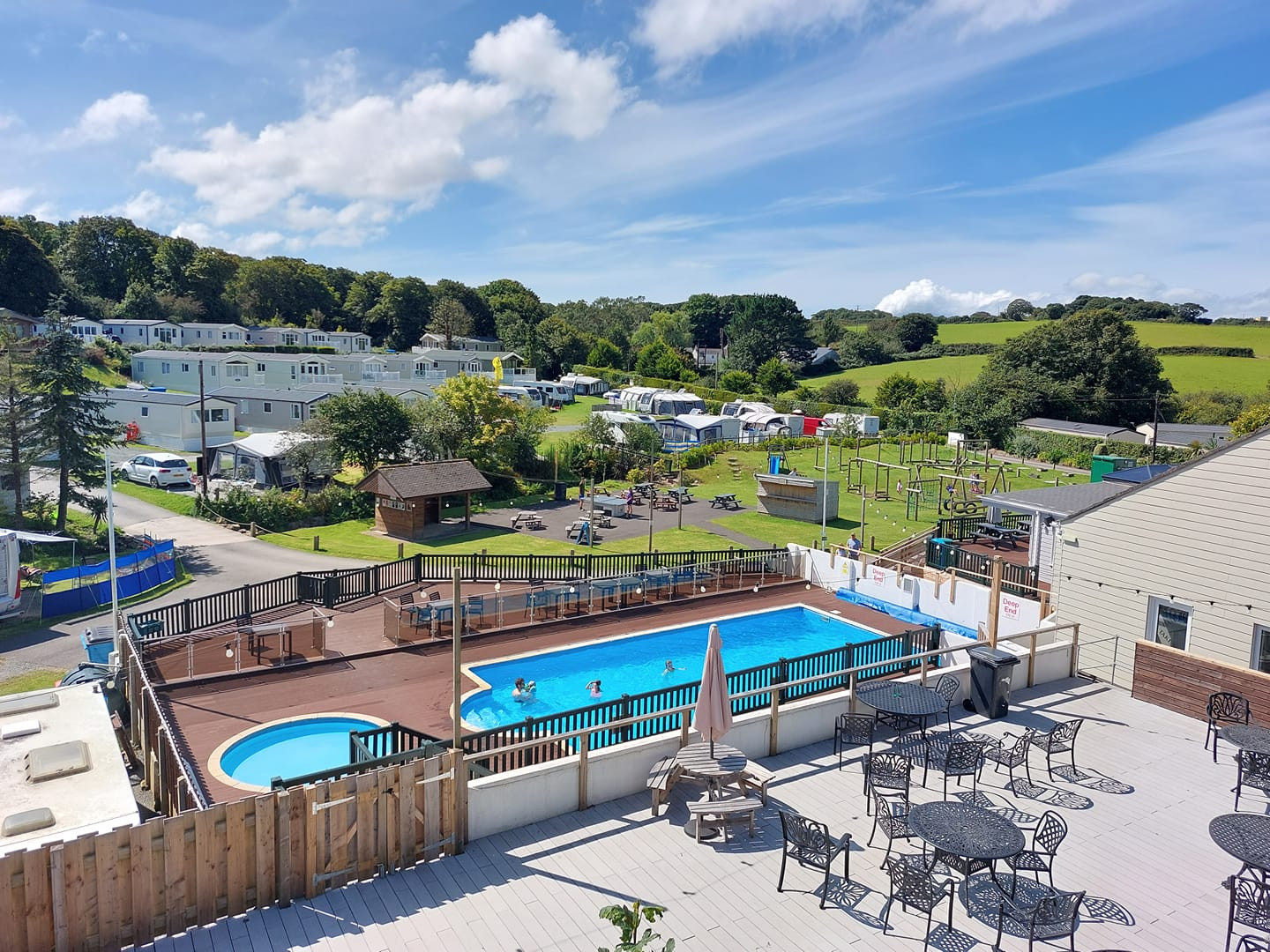 Calloose Holiday Park, its accommodation and outdoor swimming pool